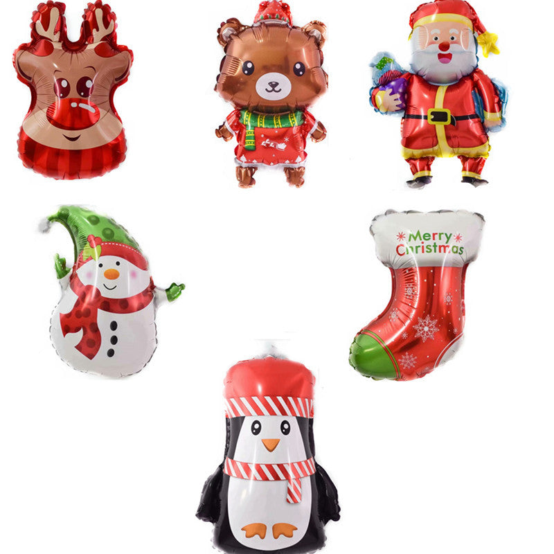 Six Christmas-themed balloons: reindeer, teddy bear, Santa, snowman, red stocking with "Merry Christmas," and a penguin in a red hat and scarf.