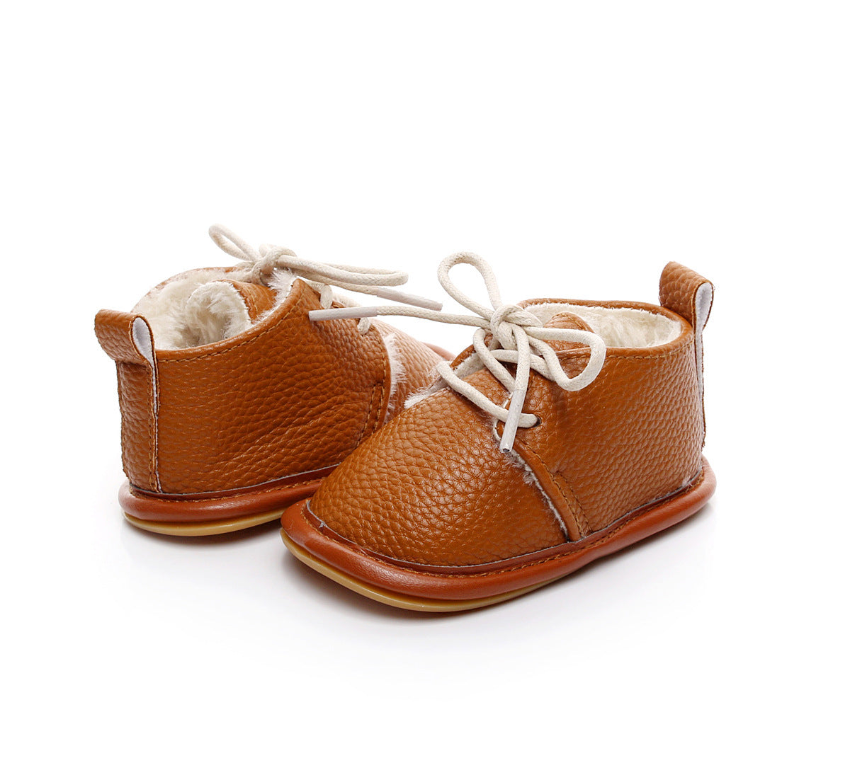 Brown leather baby shoes with white laces and plush lining, designed for warmth and comfort. The shoes have textured surfaces and soft soles, ideal for infants.