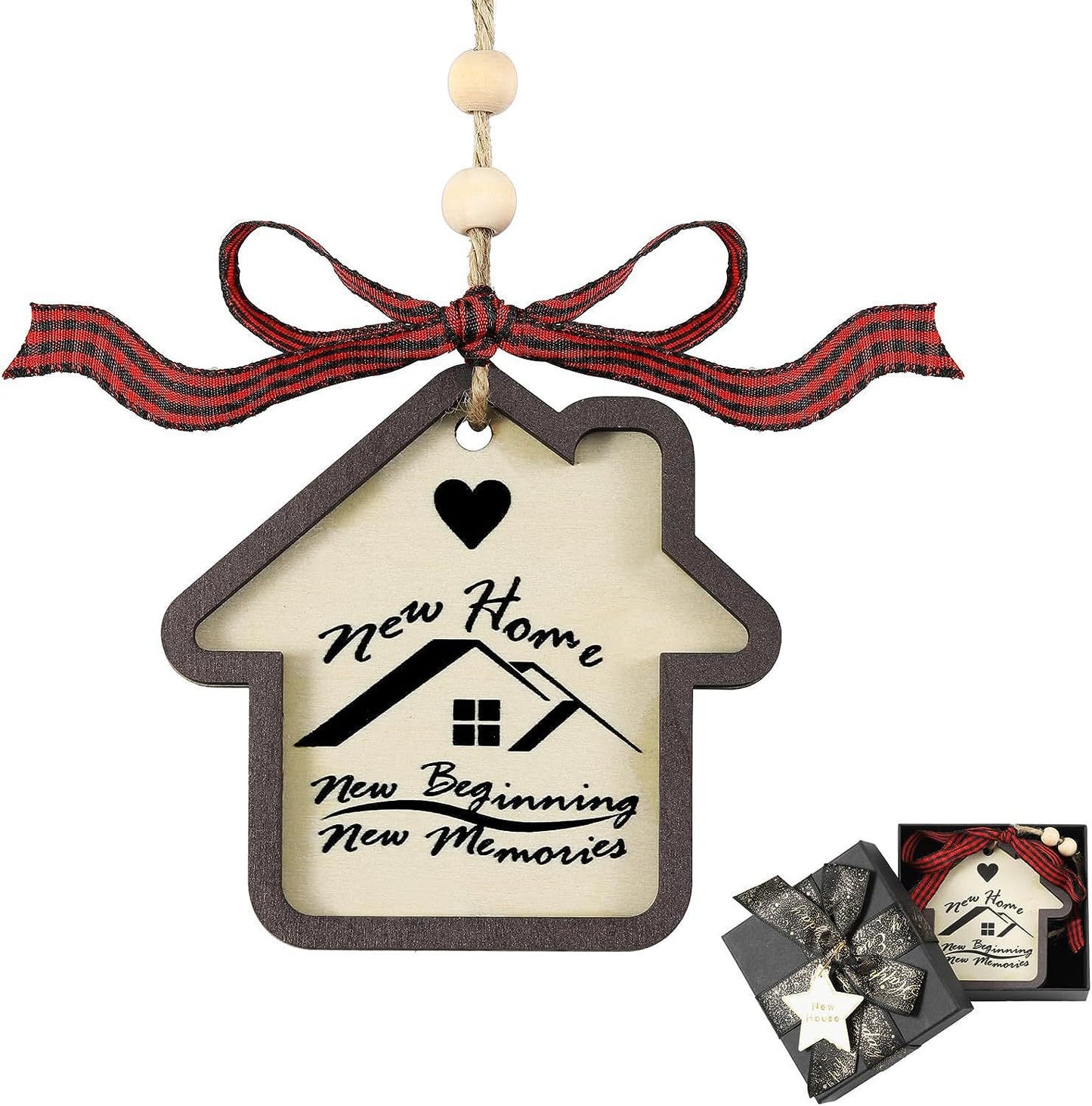 House-shaped ornament with a heart, black and red ribbon, and text: "New Home, New Beginning, New Memories." There's a gift box with a similar design in the corner.