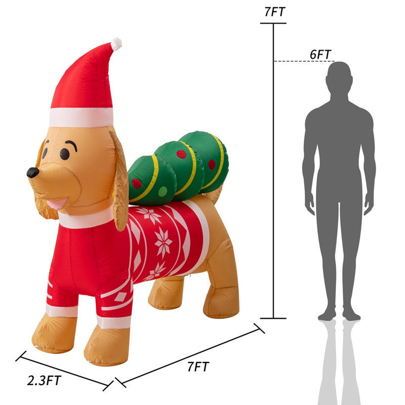 Inflatable Christmas dog decoration, dressed in red and white, with green gift sack, measuring 7 feet long. A human silhouette for size comparison is shown alongside.