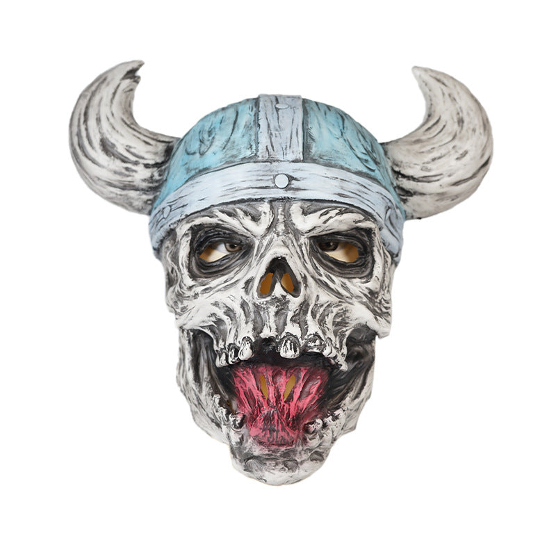 A menacing skull mask with a horned Viking helmet. The mask features a wide, open mouth with a red tongue, exaggerated facial details, and hollow eyes, giving it a fierce expression.