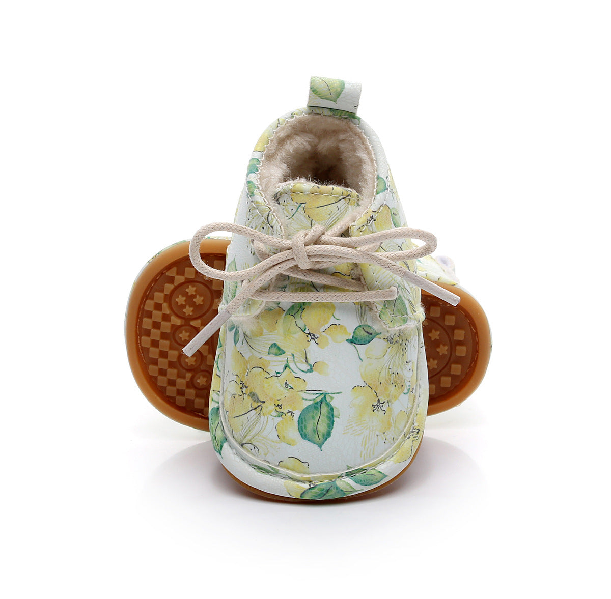 Floral printed baby shoes with yellow and green flowers, beige laces, and soft lining. The brown sole is textured for grip. Stylish and cozy for little feet.