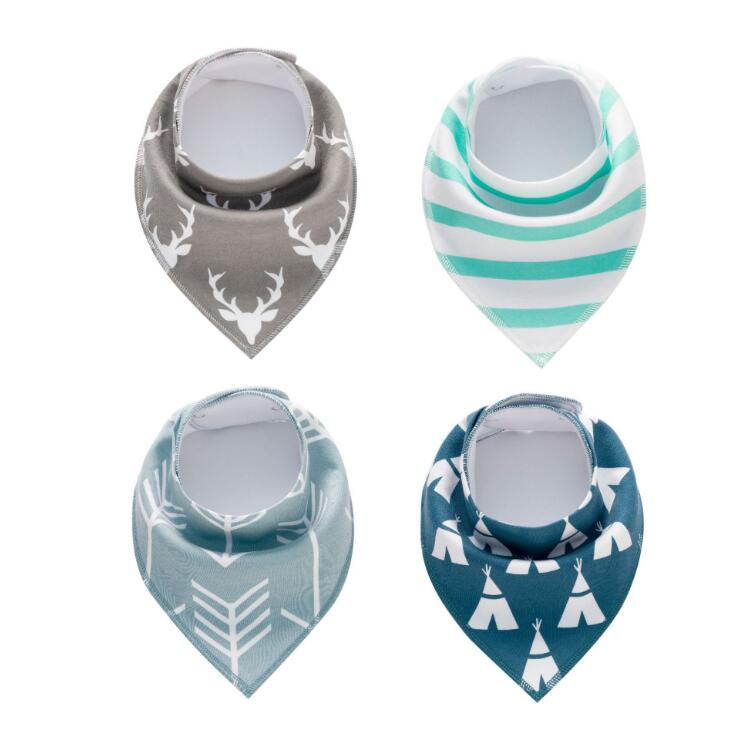 Four baby bandana bibs are arranged in a square. Designs include deer heads on gray, green stripes, arrows on teal, and teepees on dark teal. Each bib has a rounded neck opening.