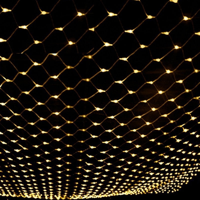 A grid of warm white string lights against a dark background, creating a glowing diamond pattern resembling a net.