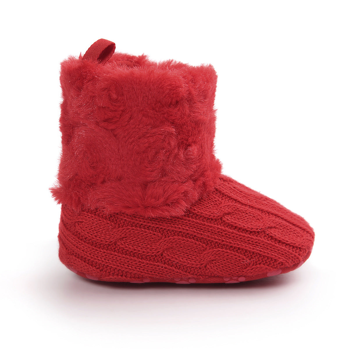 Red baby boot with a knitted texture and fluffy fur trim. The boot features a cable knit pattern and a small loop at the top for easy handling, set against a white background.