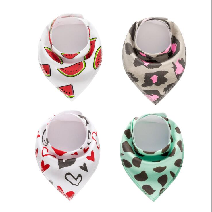 Four baby bibs with different patterns: watermelon slices on white, pink and gray camouflage, red and black hearts on white, and brown spots on mint green.
