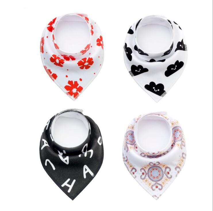 Four bandanas are displayed: one with red flowers, one with black smiling clouds, a black one with white letters, and a white one with multicolored paisley patterns.