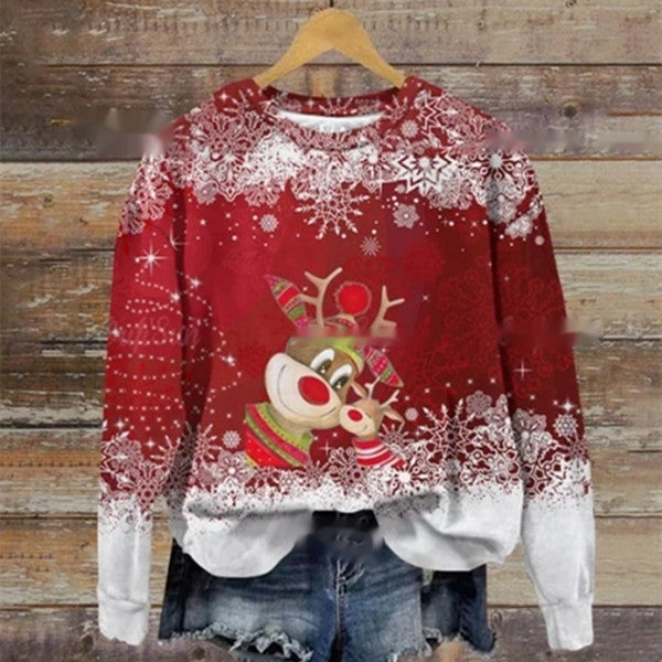 Red Christmas sweater with a reindeer graphic, featuring colorful accessories, surrounded by a snowflake pattern. Paired with denim shorts, it's displayed on a wooden background.