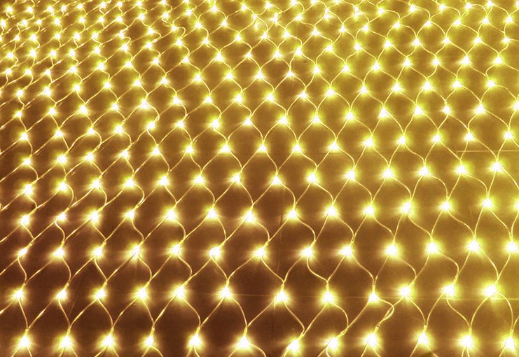 A grid of warm white string lights creates a glowing net-like pattern against a dark background, creating a cozy and festive ambiance.