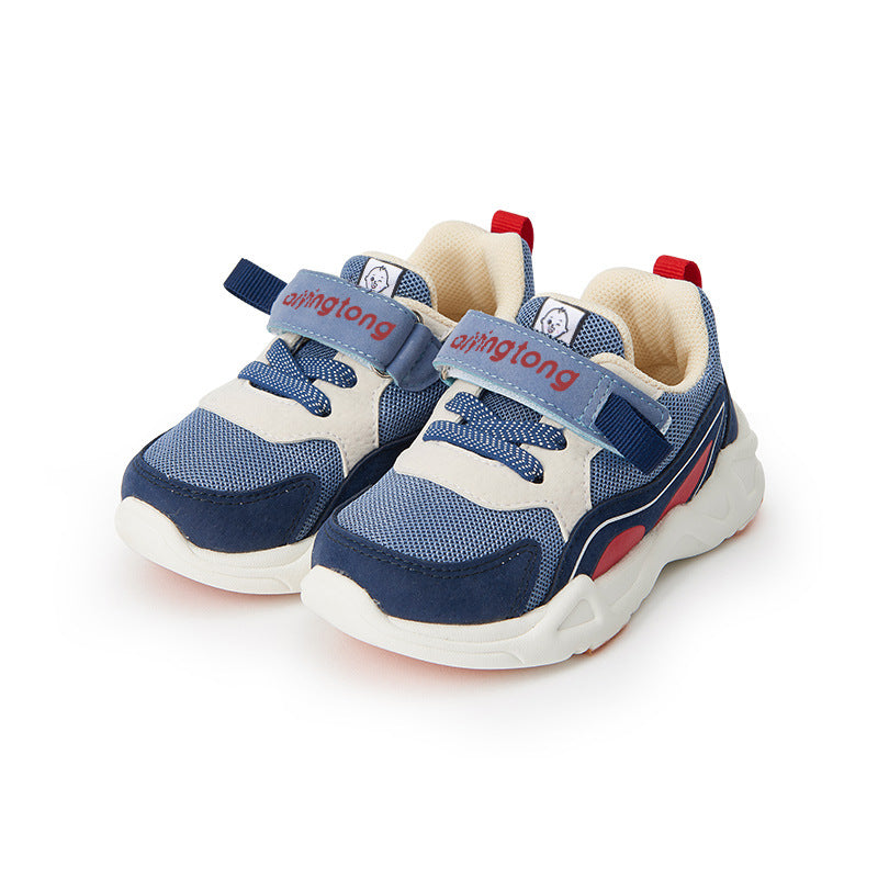 Blue and cream children's sneakers with red accents feature mesh fabric, hook-and-loop straps, and a playful design. The brand name is visible on the straps.