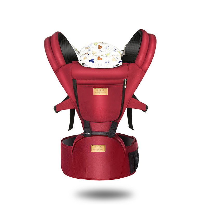 Red ergonomic baby carrier with padded shoulder straps, a floral-patterned cover, and a sturdy waist belt. Designed for comfort and support, ideal for parents on the go.