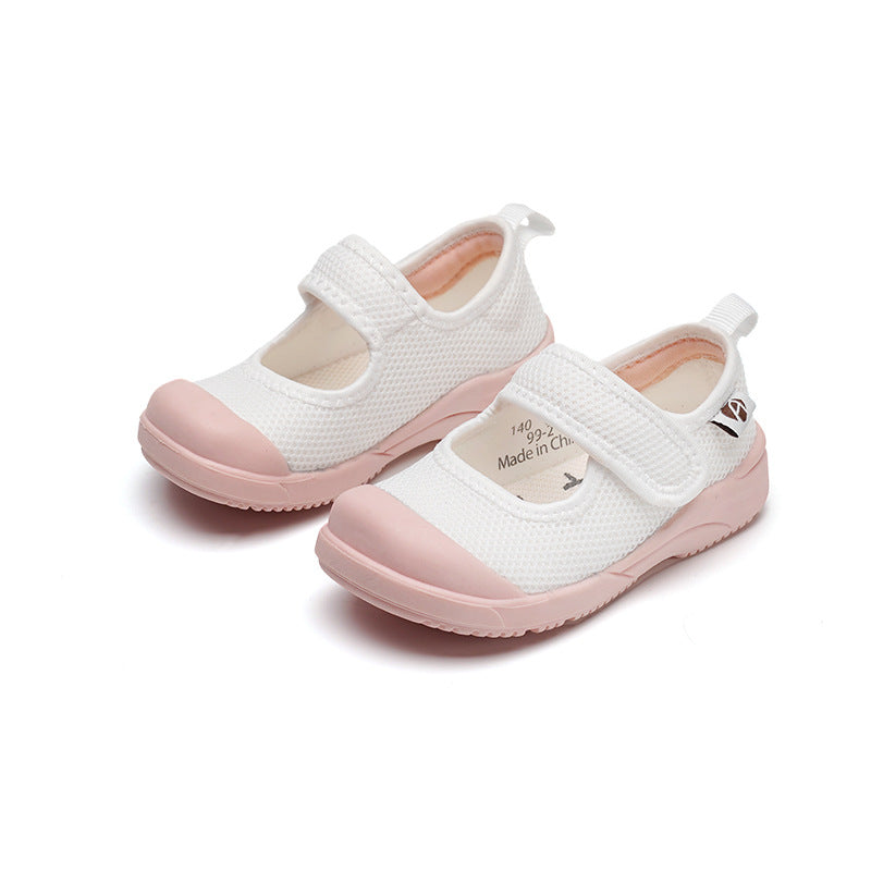 White and pink children's shoes with a Velcro strap, made from breathable mesh fabric. The shoes have a pink rubber sole and toe cap, offering a comfortable fit.