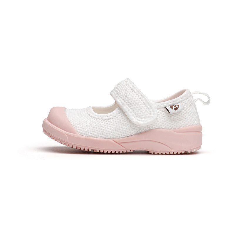 White children's shoe with a pink rubber sole and toe cap. Features a breathable mesh design and a Velcro strap for easy fastening. Side view against a plain background.