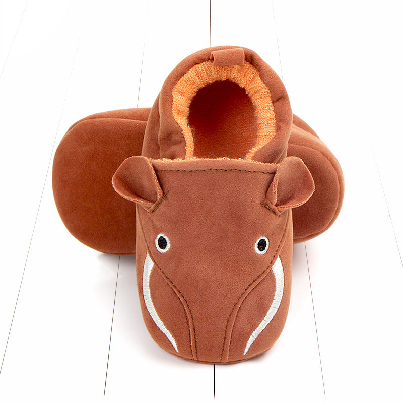 Bear-shaped plush slippers with embroidered eyes and nose, made of soft brown material, arranged on a white surface. Perfect for cozy indoor wear.