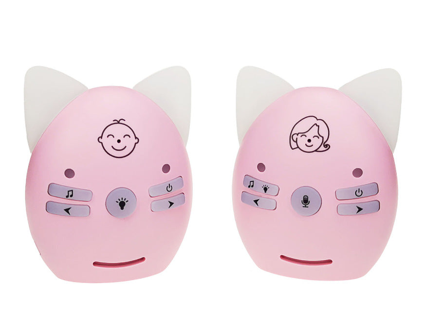 Two pink baby monitors shaped like cat ears, with smiley face icons. Buttons for music, microphone, and power are on each device, set against a white background.