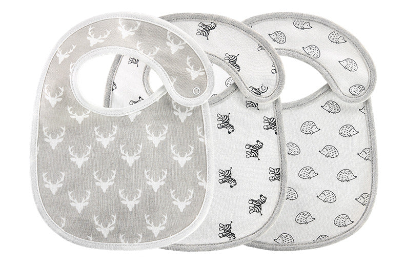 Three baby bibs with different designs: gray with white deer, white with zebra pattern, and white with hedgehog pattern. Each has a snap closure on the side.