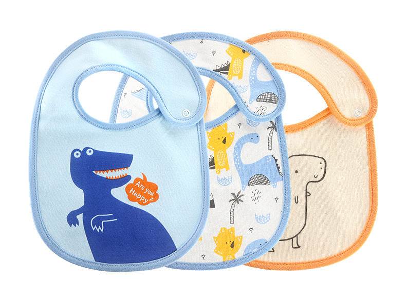 Three baby bibs with dinosaur designs. One light blue bib features a blue dinosaur saying, "Are you happy?" The second bib has a mix of yellow and blue dinosaurs. The third is plain with an orange trim.
