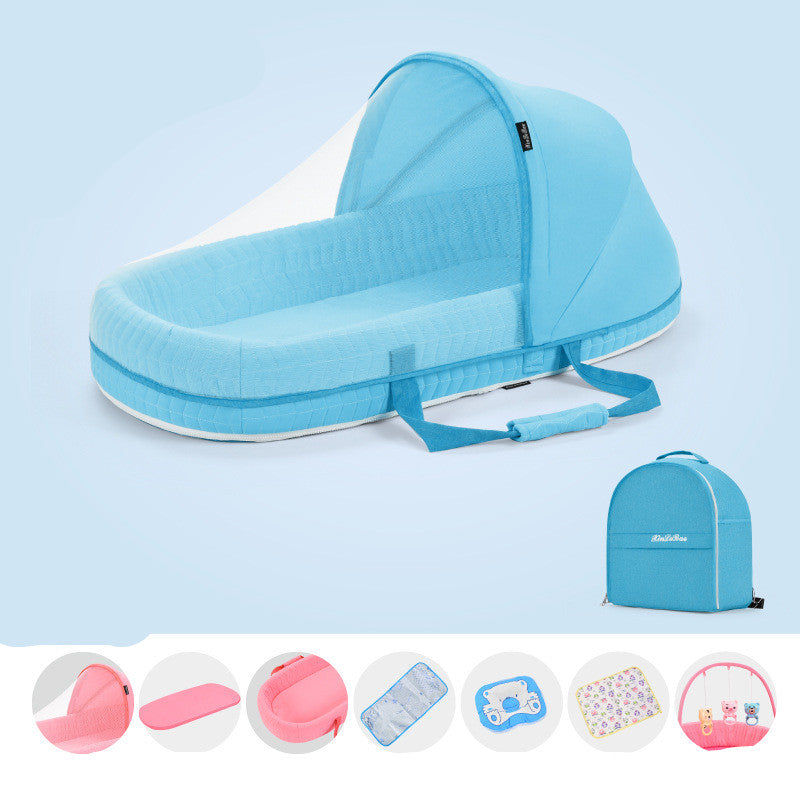 Portable blue baby travel bed with a canopy and carrying handles. Includes a matching backpack and accessories like changing mat and toys. Perfect for easy transport.