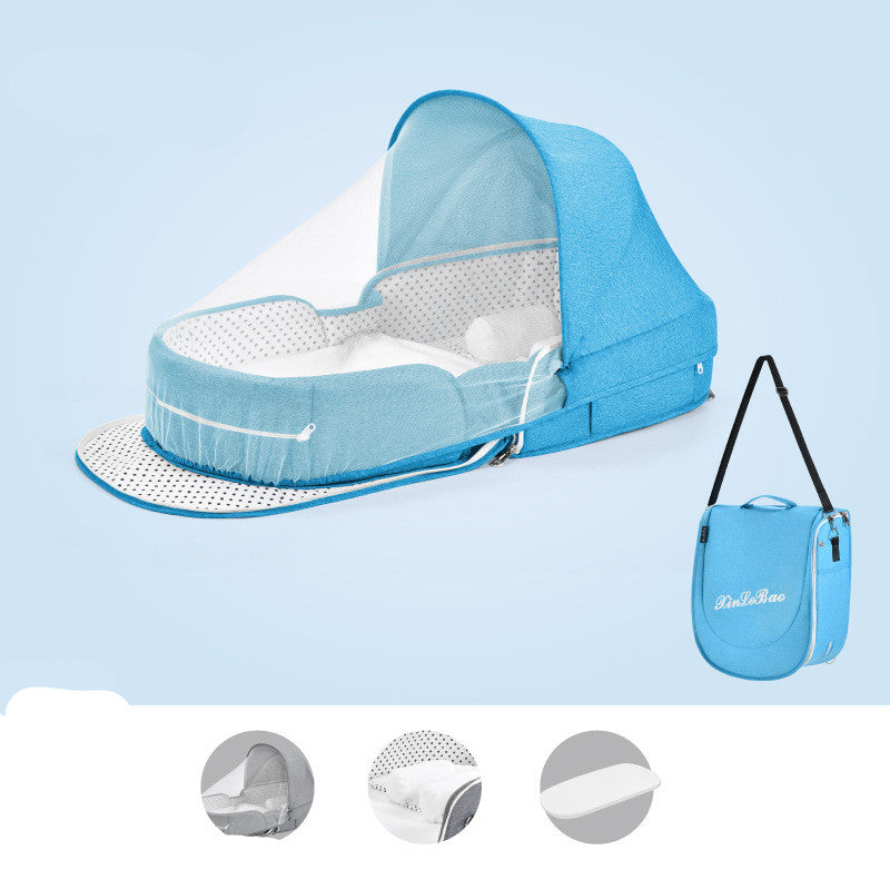 Portable baby crib in blue, featuring a canopy and breathable mesh sides. Includes a foldable design for easy carrying, shown with a matching blue carrying bag.