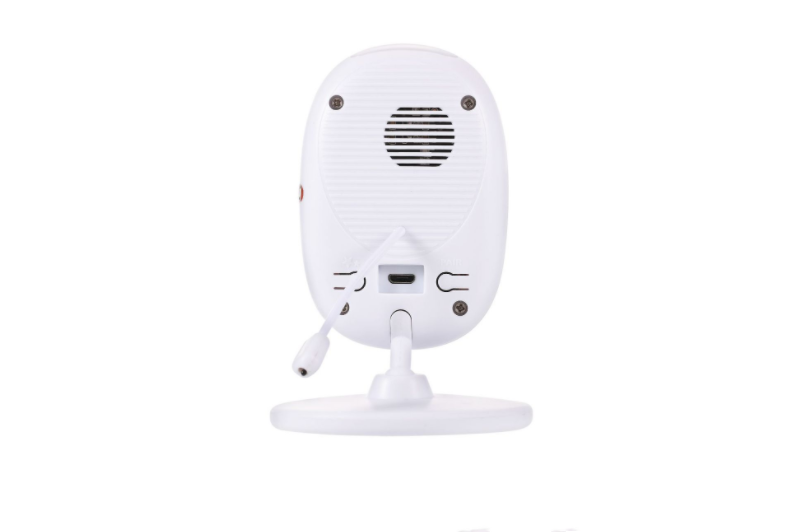 Rear view of a white security camera on a stand, showing a speaker, USB port, and power cable attached, against a plain white background.