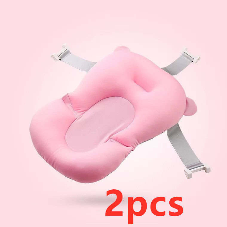 Pink baby bath cushion with adjustable straps, designed for comfort and safety. The soft, contoured shape supports the baby’s head and body. Text reads "2pcs" in bold red.