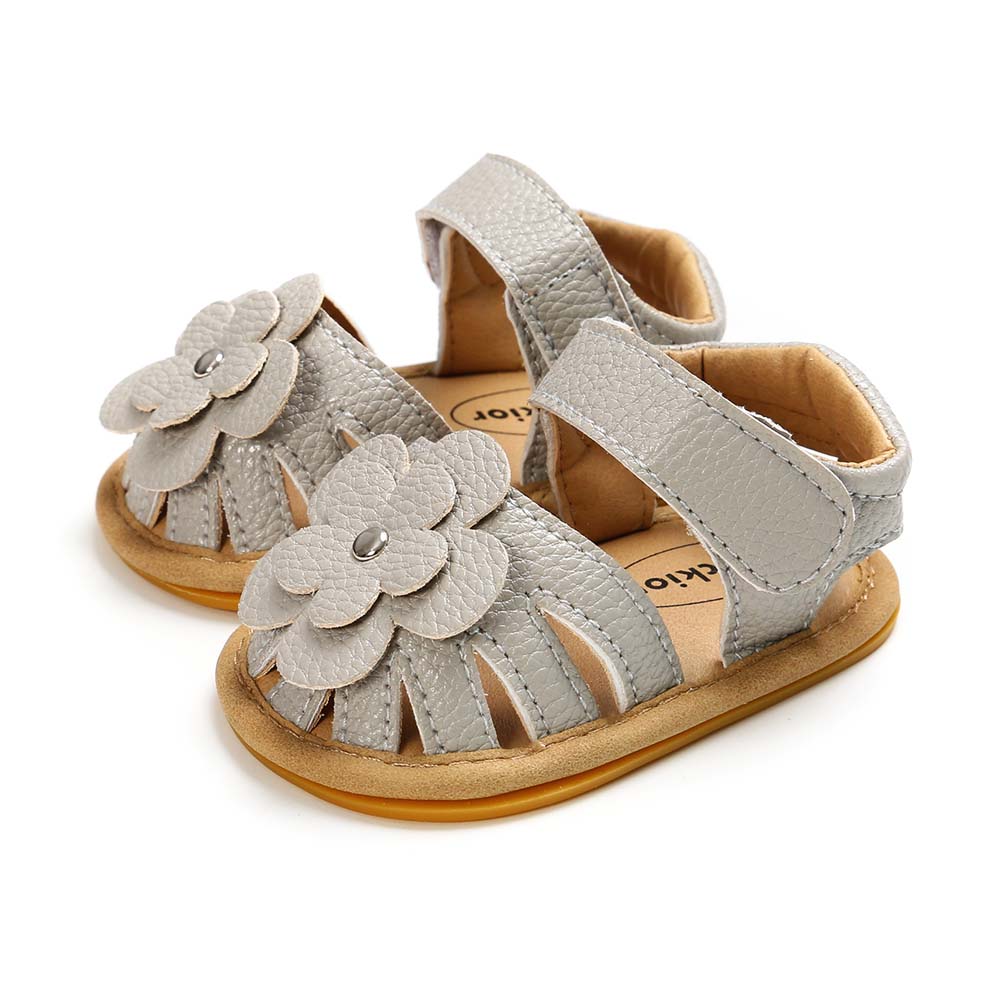 Gray toddler sandals with flower decorations and adjustable straps, featuring a tan sole and an open toe design.