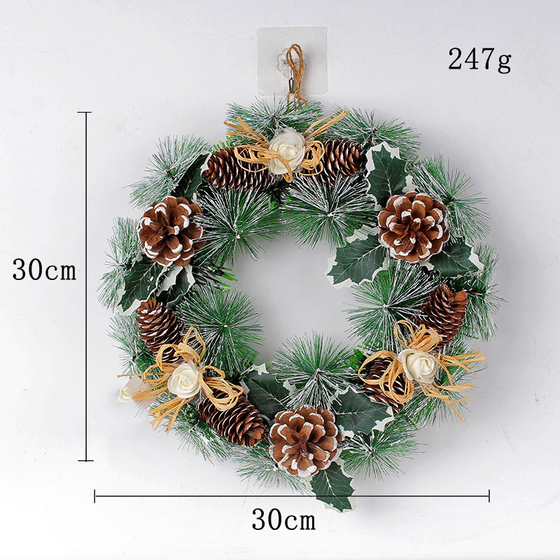 Christmas wreath, 30cm diameter, 247g. Features green pine branches, brown pinecones, white roses, and gold bows.
