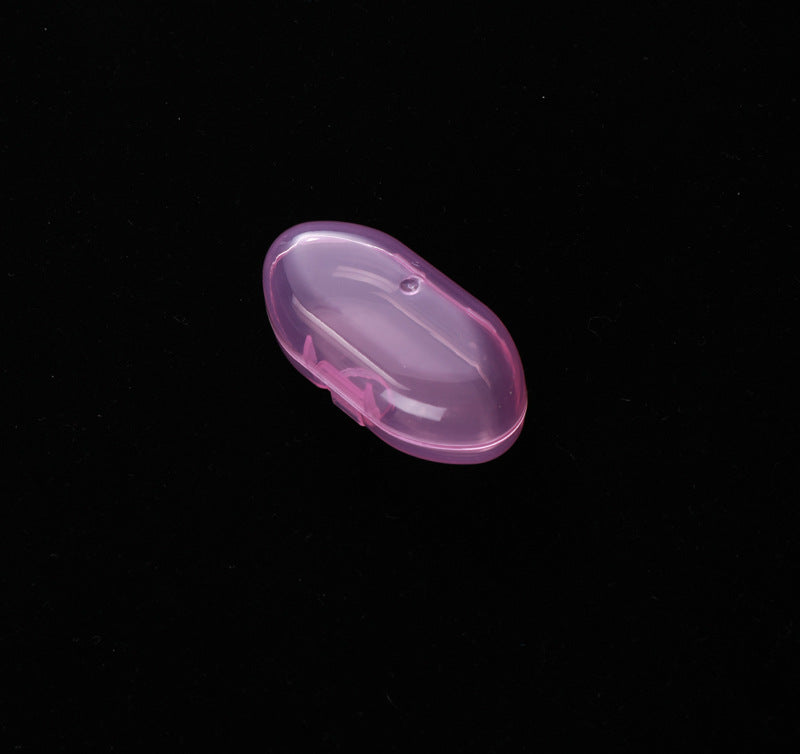 A pink, translucent plastic case with a clamshell design sits closed against a black background.