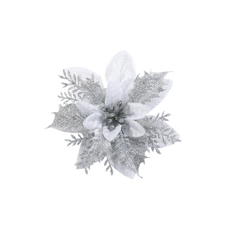 Glittery silver poinsettia with layered petals and fern-like leaves on a white background, creating an elegant and festive decoration.