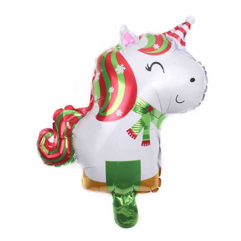 Festive unicorn balloon with a red and green striped mane, wearing a striped hat and scarf, adorned with snowflakes on a glossy white surface.