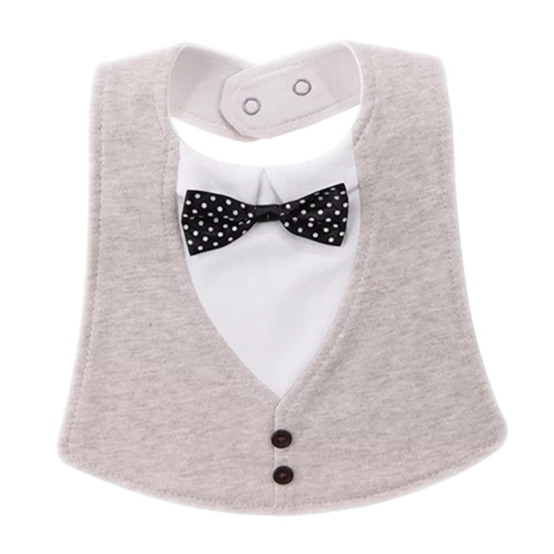 A baby bib designed like a mini tuxedo with a gray vest, white shirt, black polka dot bow tie, and two brown buttons. It features a snap closure at the neck.