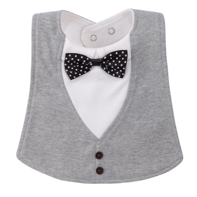A baby bib designed like a tuxedo, with a gray vest, white shirt inset, black and white polka dot bow tie, and two buttons, featuring snap closures at the neck.