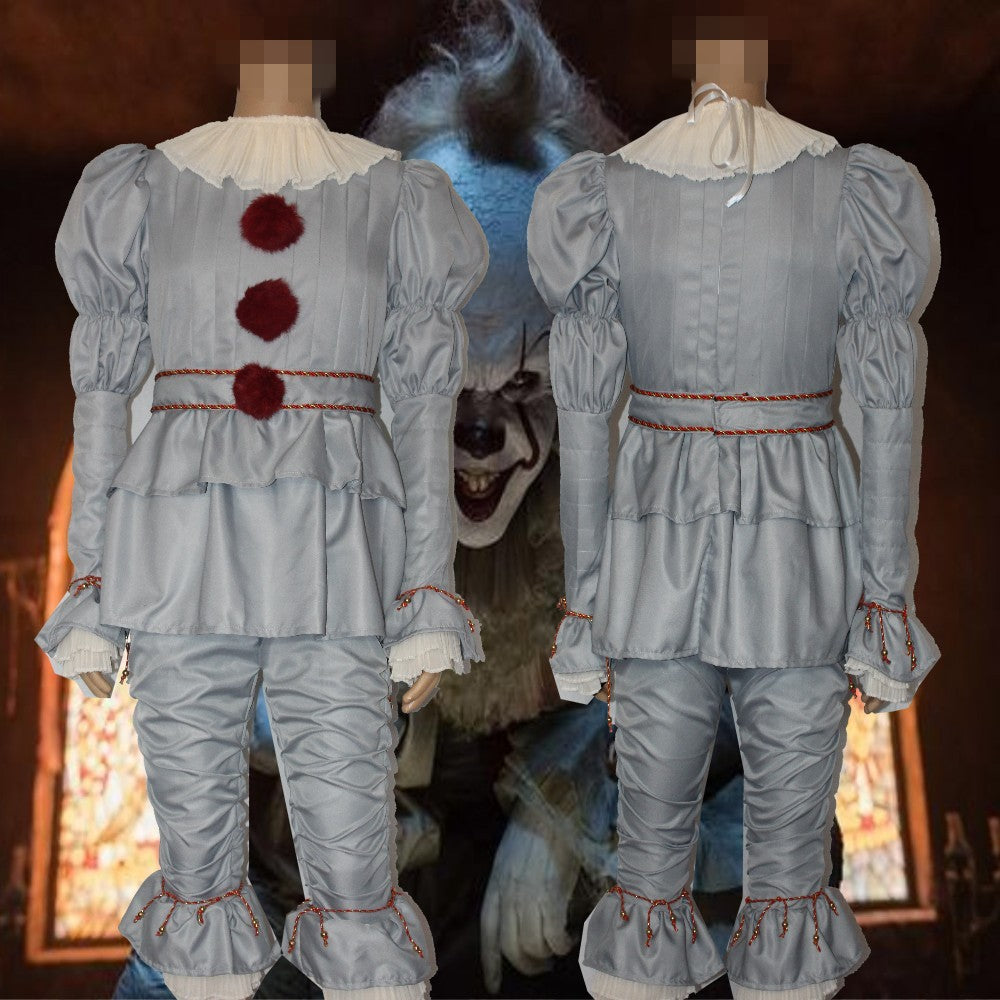Two gray clown costumes with red pom-poms and ruffled collars, viewed from the front and back. A sinister clown face looms in the dimly lit background.