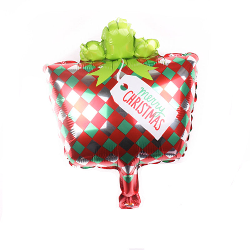 Festive balloon shaped like a gift box with a red and green checkered pattern, adorned with a green bow and a tag reading "Merry Christmas" in red script.