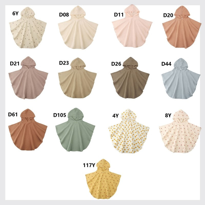 A collection of hooded ponchos in various pastel and neutral colors, some with polka dot patterns. Each poncho is labeled with a code like "6Y", "D08", "4Y", and more.