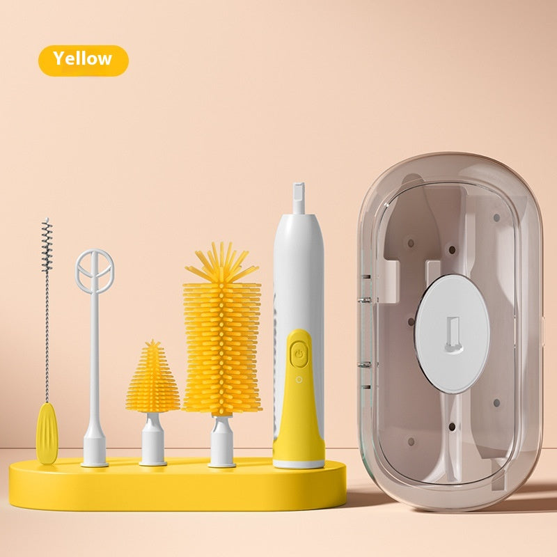 Yellow cleaning brush set with various attachments for different surfaces, including a power handle, on a matching base. A transparent storage case is placed to the right.