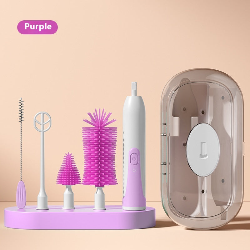 Purple bottle cleaning set on a pink base, featuring various brushes, an electric scrubber with attachments, and a clear storage case against a beige background.