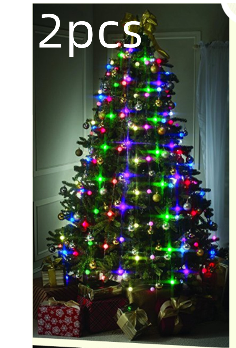 Christmas tree decorated with multicolored lights and ornaments, topped with a gold bow. Wrapped gifts with bows are underneath. Large "2pcs" text is overlayed at the top.