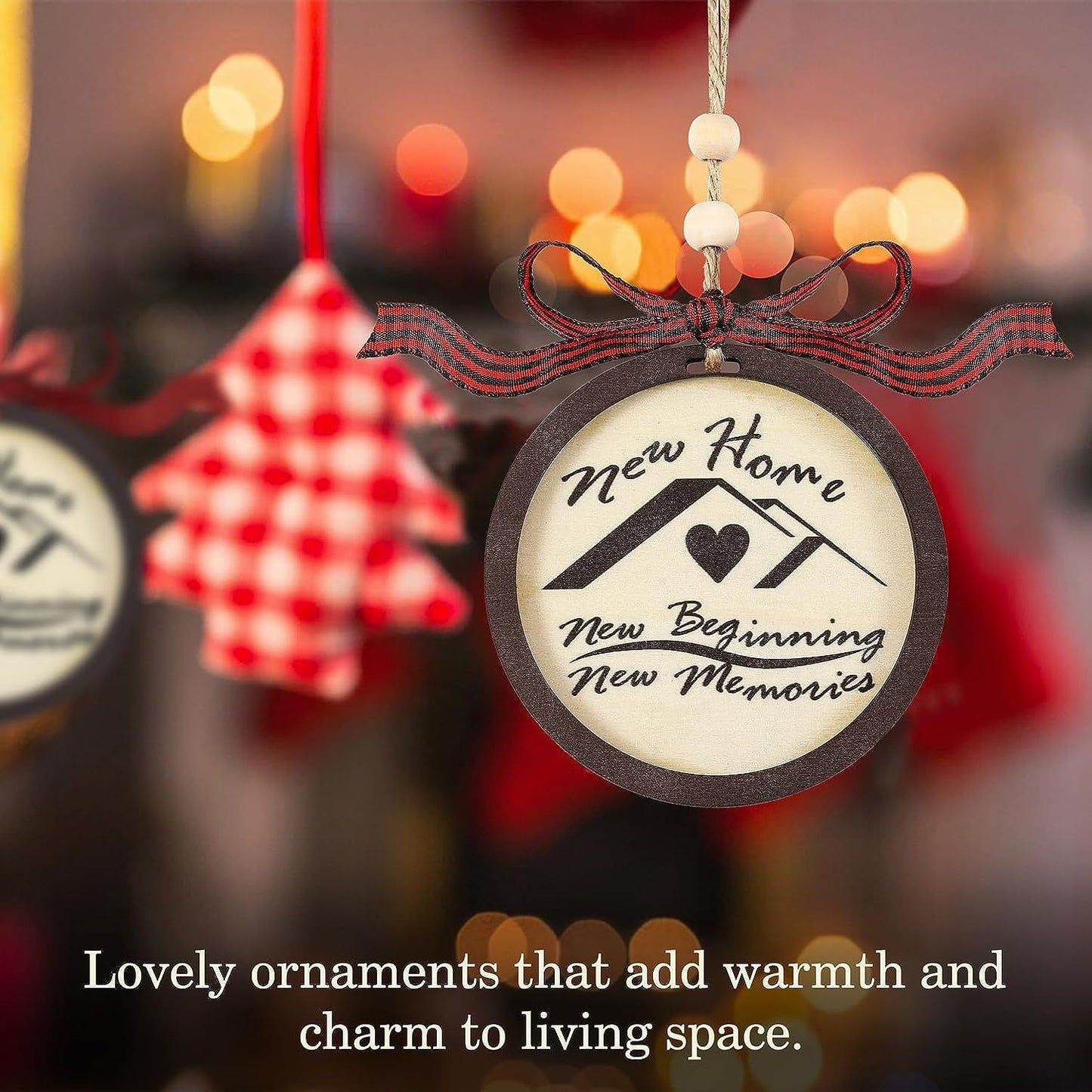 A decorative ornament with a house design says, "New Home, New Beginning, New Memories." It's adorned with a ribbon, set against a blurred, festive background.