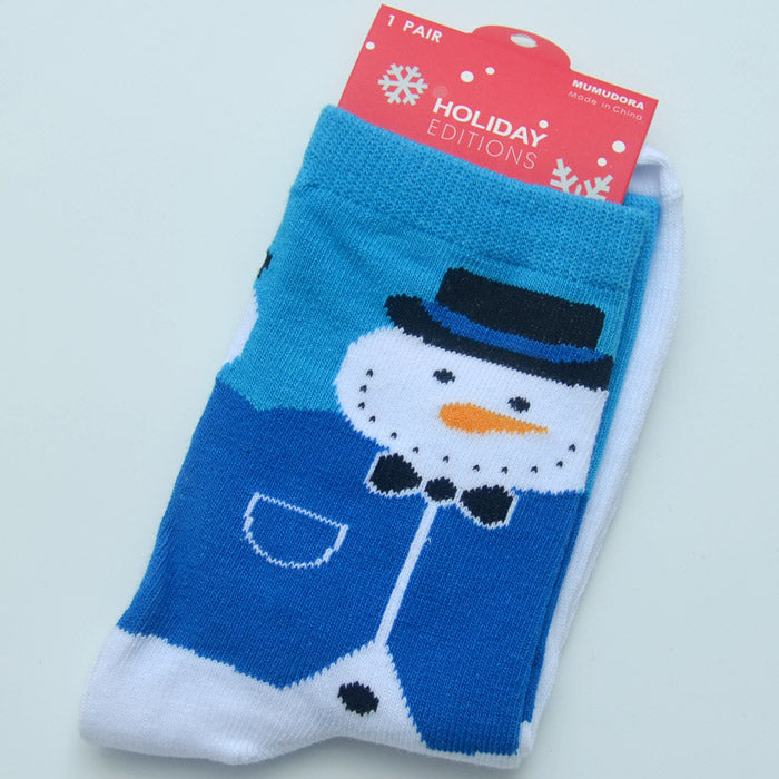 Pair of blue and white holiday socks featuring a snowman with a black hat and bow tie. The label reads "Holiday Editions" against a red background with snowflakes.