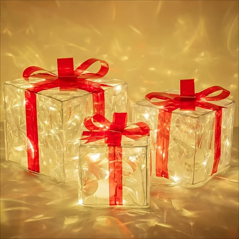 Three transparent gift boxes with glowing lights inside, each tied with a vibrant red ribbon, creating a warm and festive ambiance against a soft background.