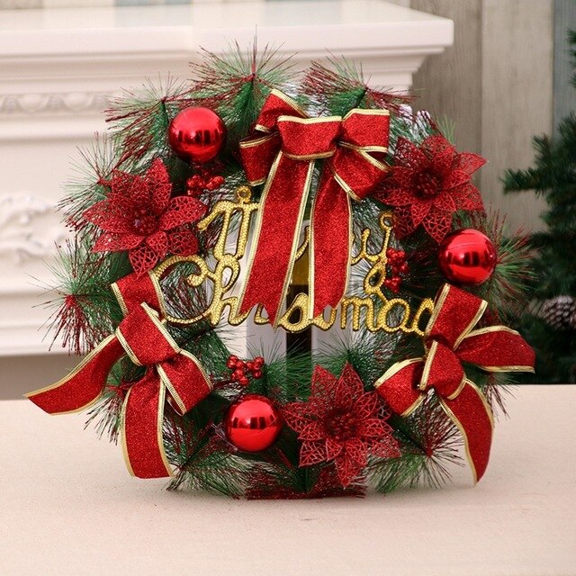 A festive Christmas wreath with red bows, poinsettias, and ornaments, accented by green pine needles. The words "Merry Christmas" are displayed in gold at the center.
