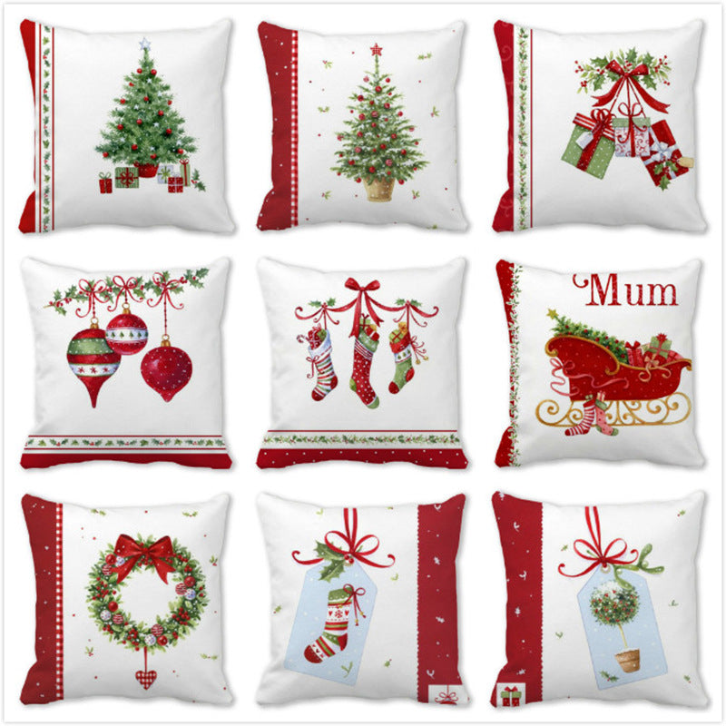 A collection of nine festive pillows with Christmas-themed designs, including decorated trees, hanging ornaments, wrapped gifts, stockings, a wreath, and a sleigh with the word “Mum.”