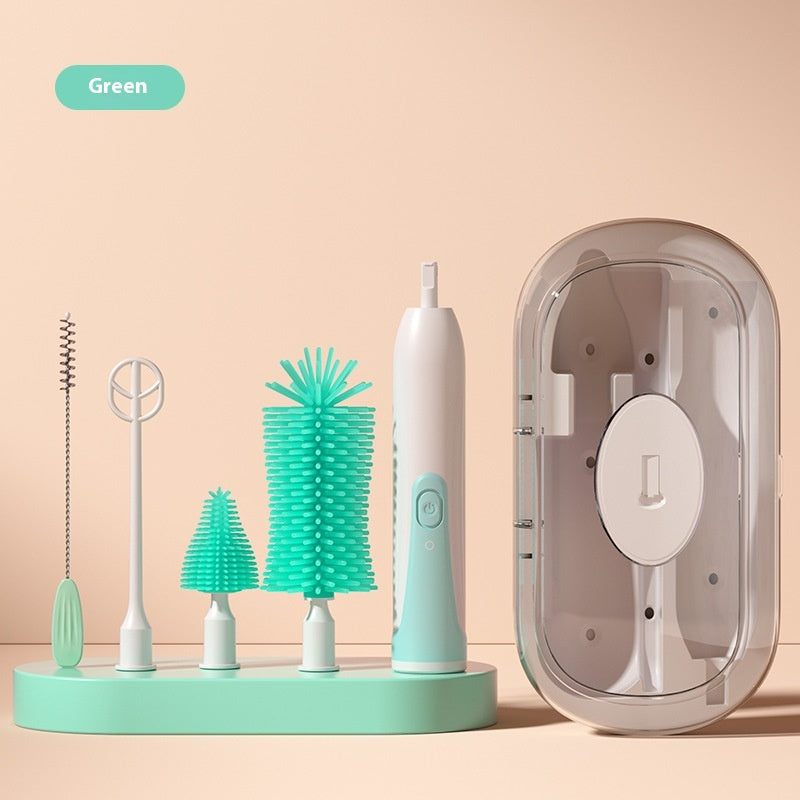 Green cleaning set includes a motorized handle, various brush heads, and a transparent case for storage, all arranged neatly on a matching base against a beige background.