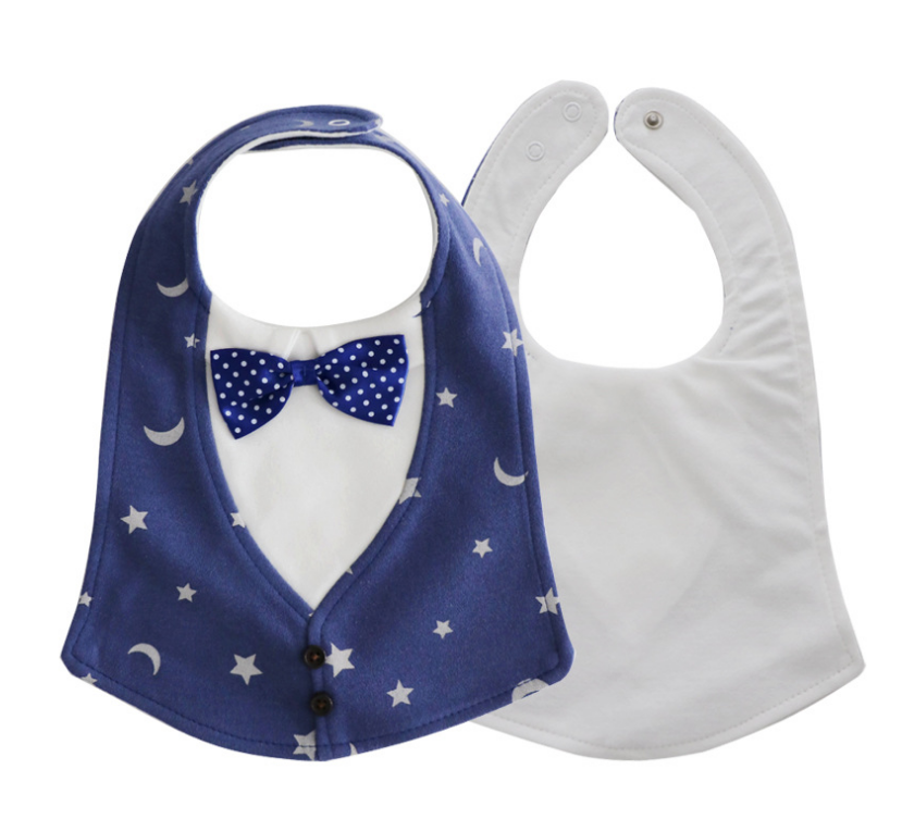 Two baby bibs: one designed like a tuxedo with a blue starry pattern and dotted bow tie, and one plain white bib with snap closures in the background.