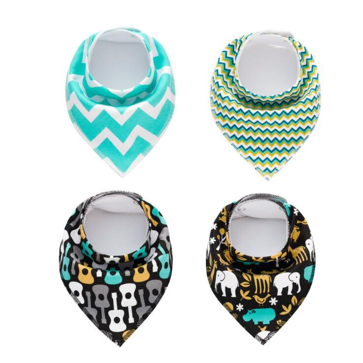 Four baby bibs are displayed: two with zigzag patterns in turquoise and green hues, and two with black backgrounds featuring guitar and jungle animal patterns.