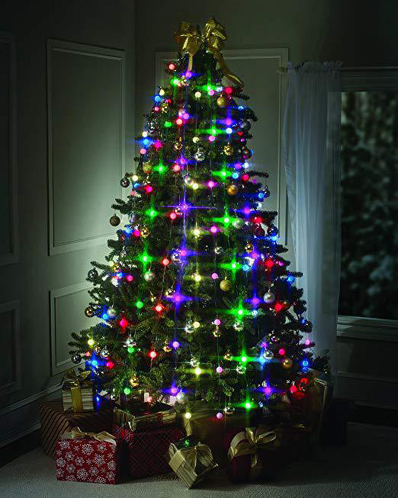 A beautifully decorated Christmas tree with colorful lights and ornaments, topped with a gold bow. Presents wrapped in festive paper are neatly placed underneath.