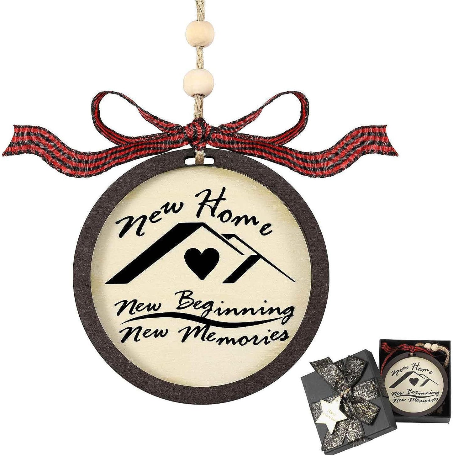 Round ornament with the text "New Home, New Beginning, New Memories" above a house with a heart. It has a red plaid bow and is shown in a decorative gift box.