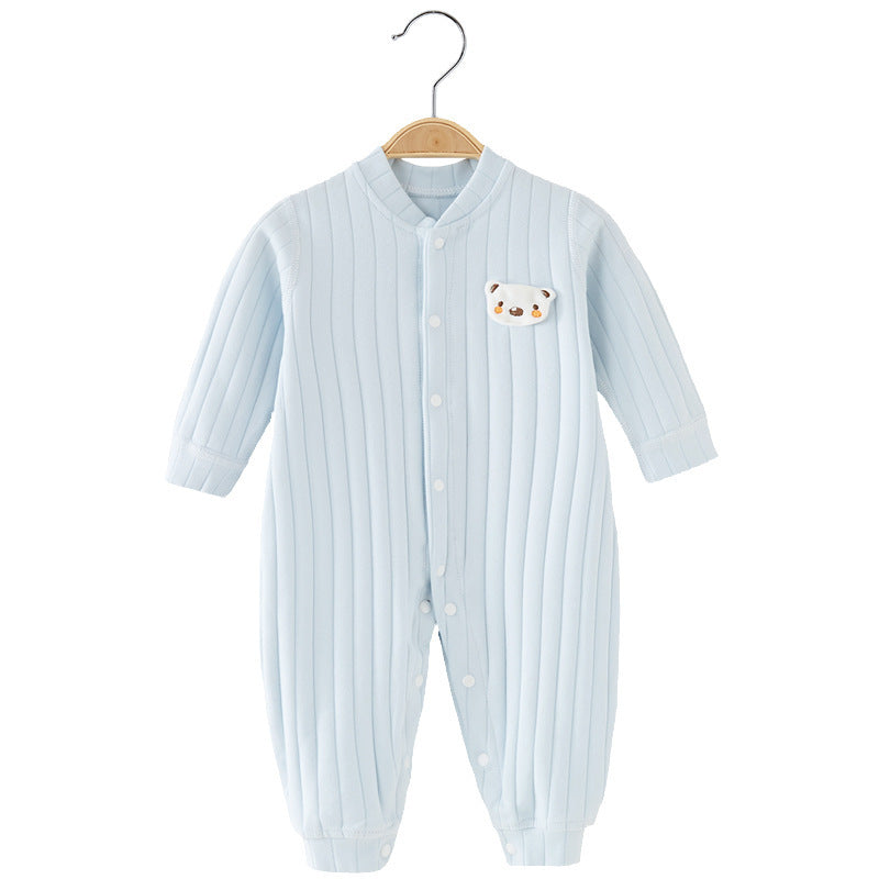 Light blue ribbed baby onesie with long sleeves and snap buttons, hanging on a wooden coat hanger. Features a small bear face patch on the left chest.