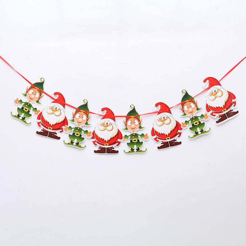 A festive garland featuring alternating cutouts of jovial elves in green and cheerful Santas in red on a red string against a plain white background.